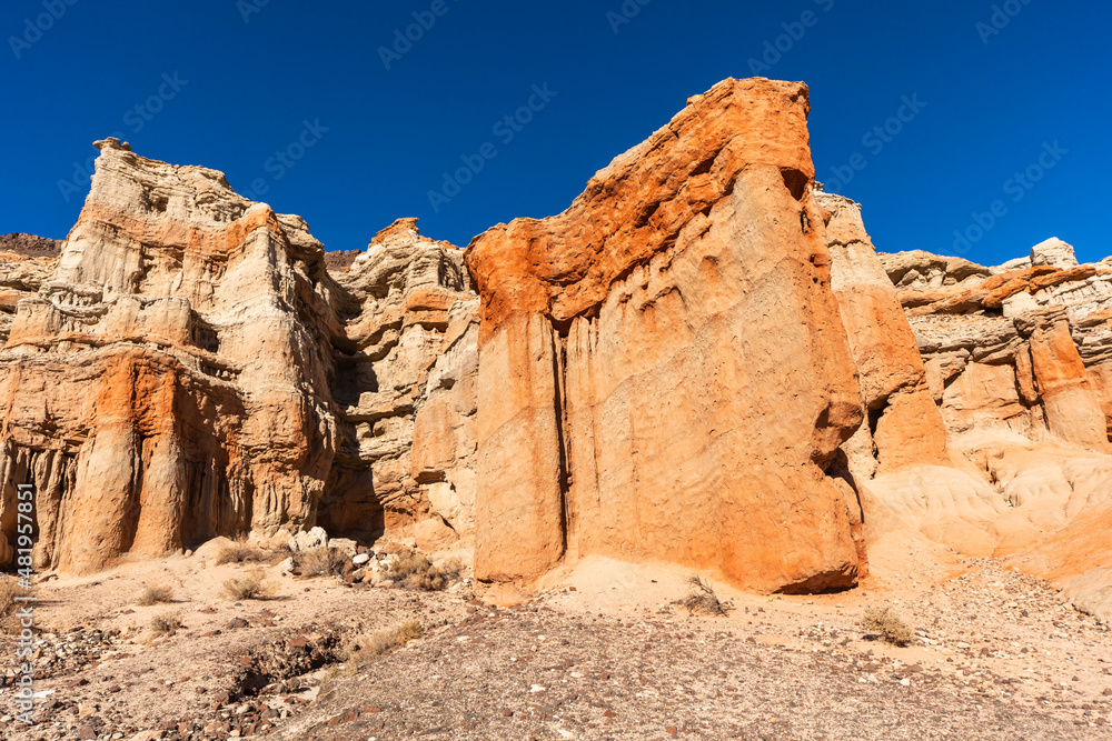 Scenery with red rock cliffs, and stone desert near Mojave, California in the west of the U.S. 