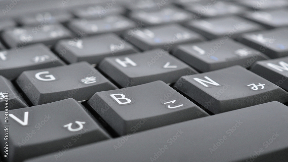 Japanese typing. Black laptop keyboard. Symbols on the buttons of hiragana. Electronic commerce in Japan. IT technologies and data storage. Computer background or wallpaper Japanese typing. Black laptop keyboard. Symbols on the buttons of hiragana. Electronic commerce in Japan. IT technologies and data storage. Computer background or wallpaper