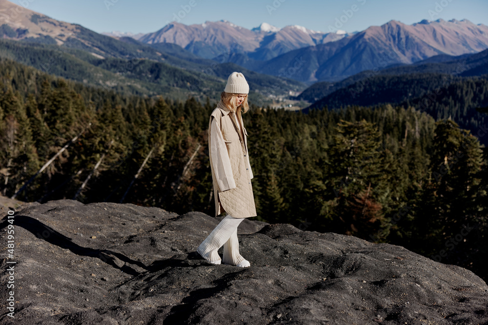 young woman Standing on the edge of a cliff nature travel relaxation young woman Standing on the edge of a cliff nature travel relaxation