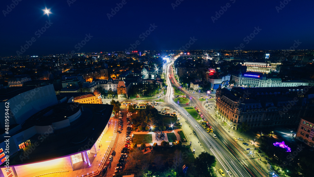Top view of Bucharest during summer evening. Bucharest from above with view to its main landmarks, night cityscape from Romania.