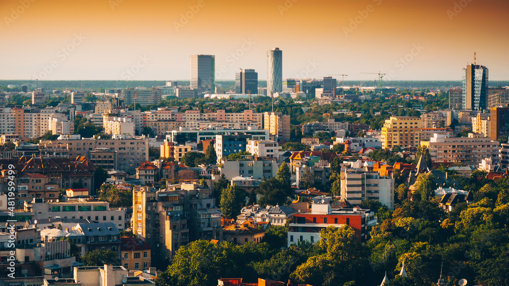 Obraz premium Bucharest view from above during summer sunrise. Landmarks of the capital city of Romania.