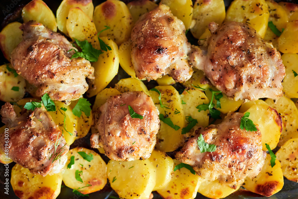 Oven baked potatoes with chicken. Baked potatoes with chicken pieces. Oven baked potatoes with chicken. Baked potatoes with chicken pieces.