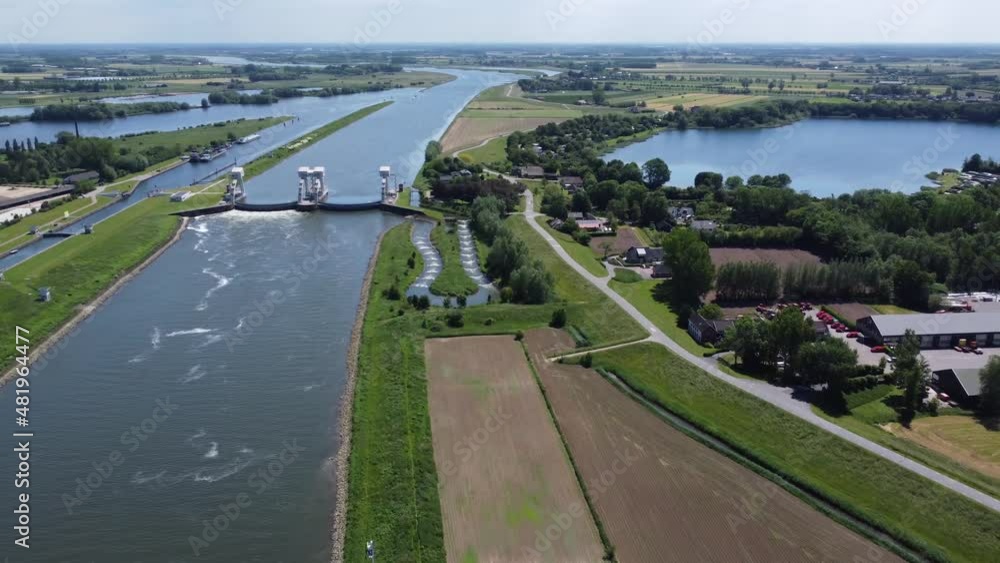 Aerial view of river and modern water channel controller controlled at both sides by a gate or lock these gates commonly control levels and flow rates in rivers and canals 4k high resolution footage Aerial view of river and modern water channel controller controlled at both sides by a gate or lock these gates commonly control levels and flow rates in rivers and canals 4k high resolution footage