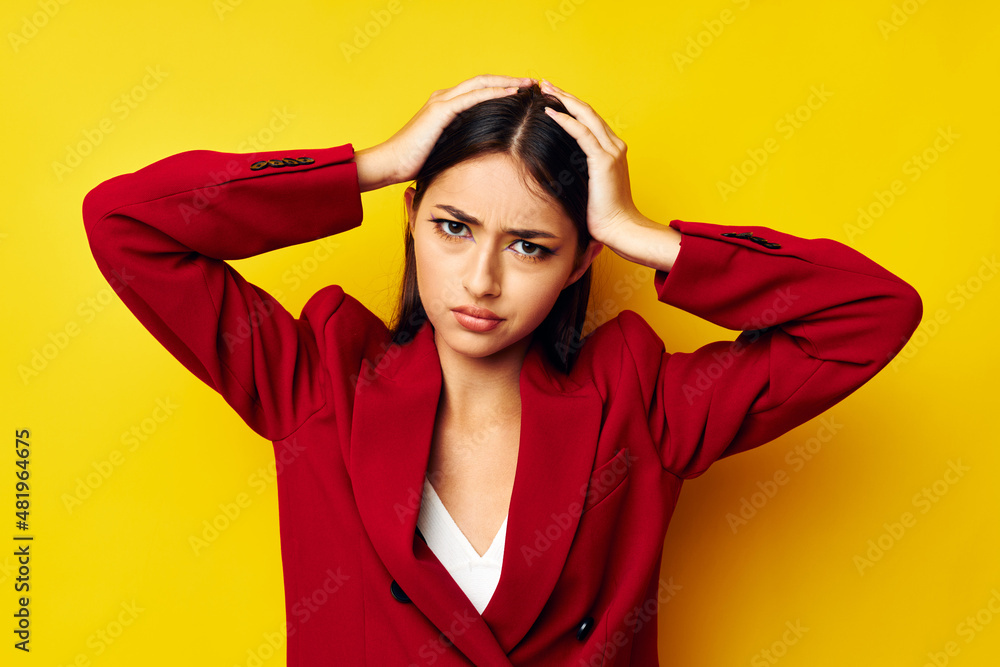 beautiful brunette in a red jacket cosmetics smile yellow background unaltered beautiful brunette in a red jacket cosmetics smile yellow background unaltered