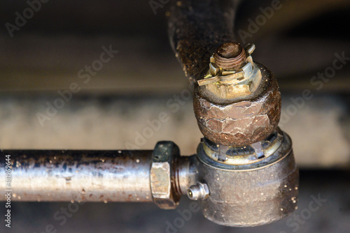 Obraz na płótnie Close-up of the truck side tie rod end in the real case. The new tie rod end. Changing a new car spare part. Car spare parts w salonie