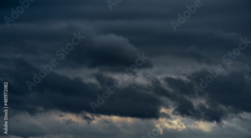 beautiful dark dramatic sky with stormy clouds before the rain or snow