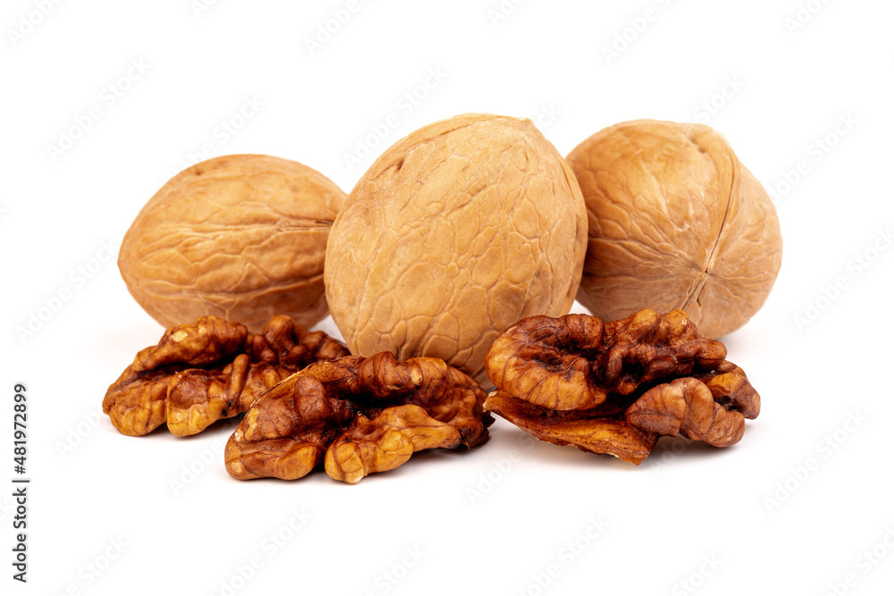Walnuts in shells isolated on white background. Package design element with clipping path. Walnuts in shells isolated on white background. Package design element with clipping path.