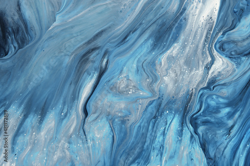 Fluid Art. Liquid blue and grey abstract paint drips and wave. Marble effect background or texture