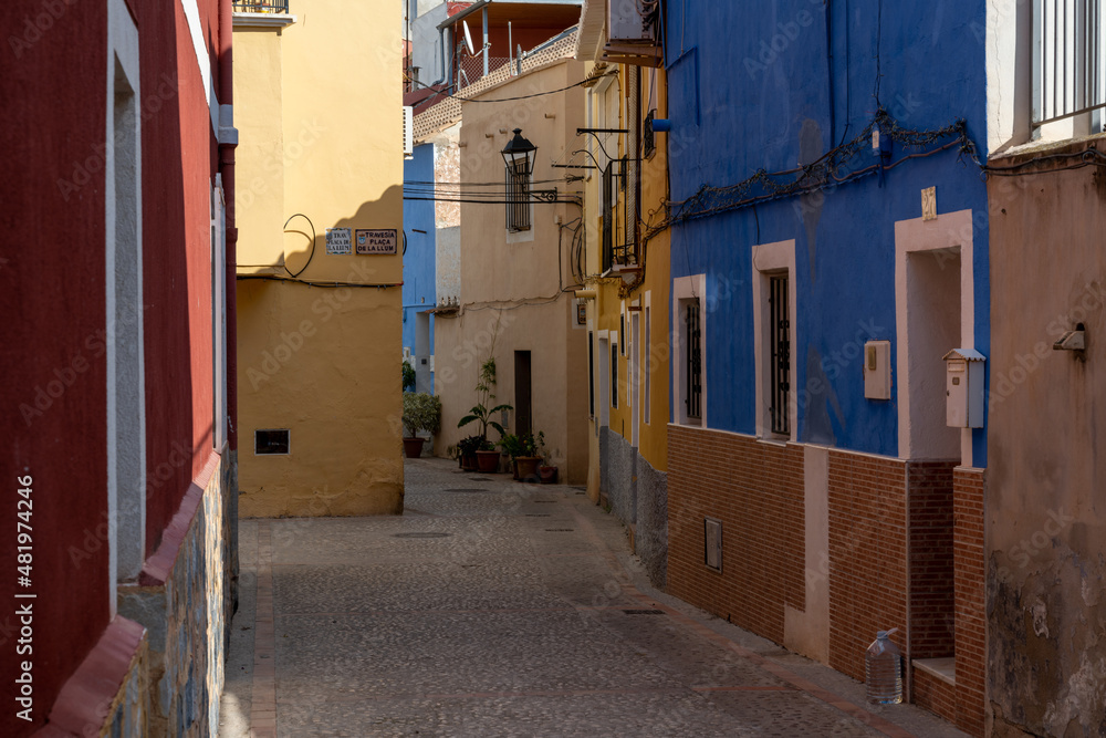 narrow street with many colorful houses in the center of the historic old town