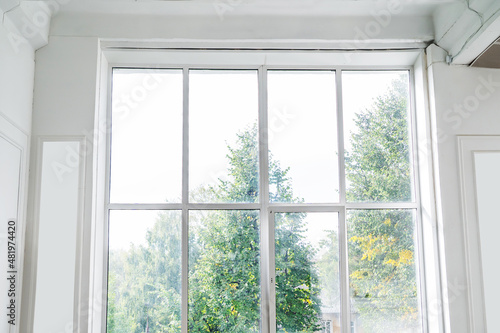 Big window. Modern glazing in a retro style in a bright room. Flat lay frame