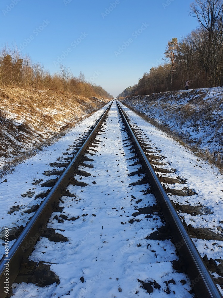 Fototapeta premium Railway track in winter with snow