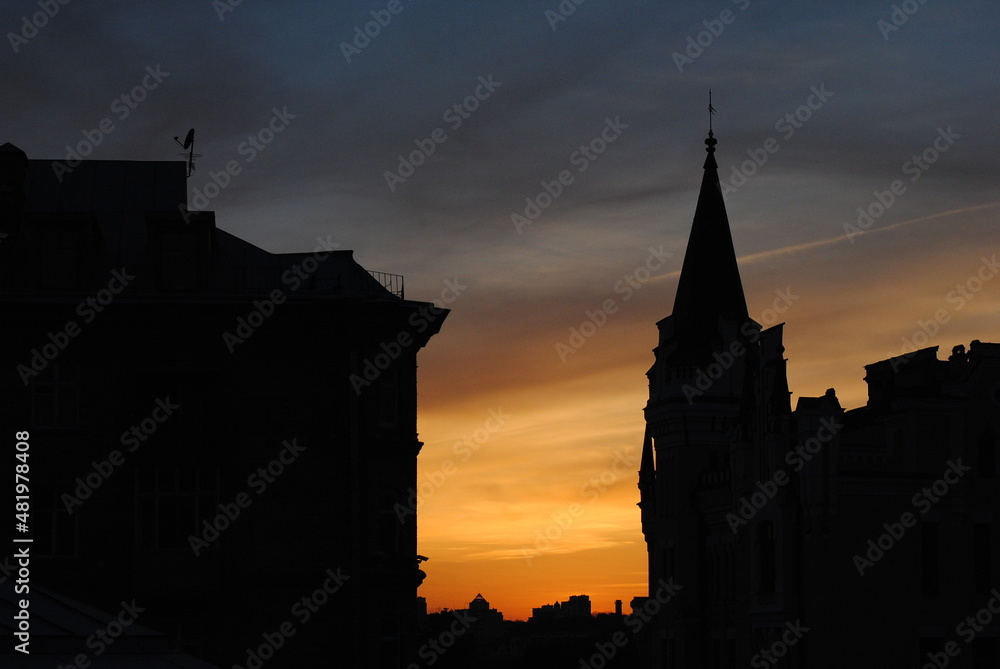 black silhouette of the old city against the sunset red sky
