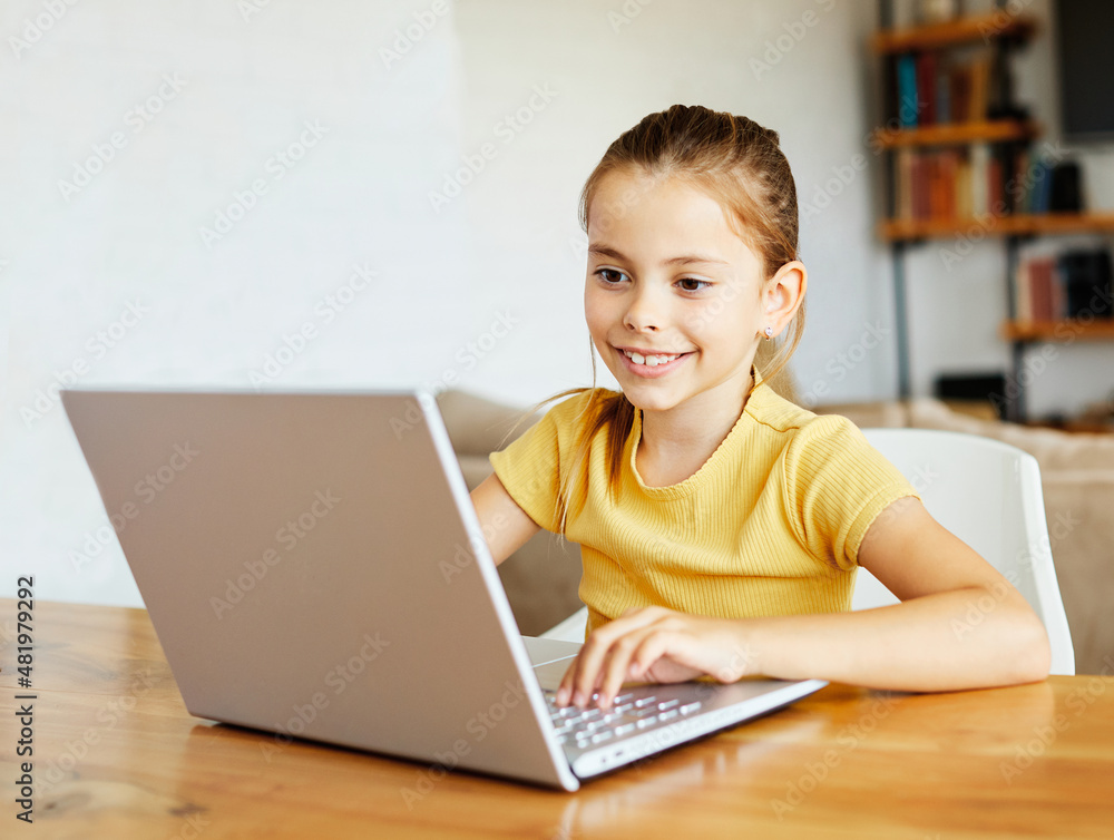 child laptop computer technology home girl education homework kid learning internet childhood student sitting connection using online child laptop computer technology home girl education homework kid learning internet childhood student sitting connection using online