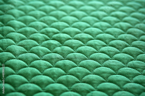 Material w kolorze zielonym, faktura, tekstura.