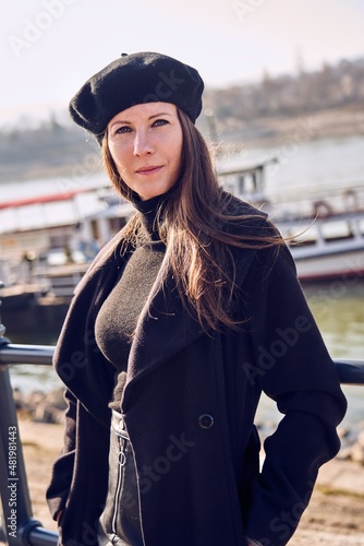 Portrait of elegant french woman outdoor wearing black clothes. © nyul