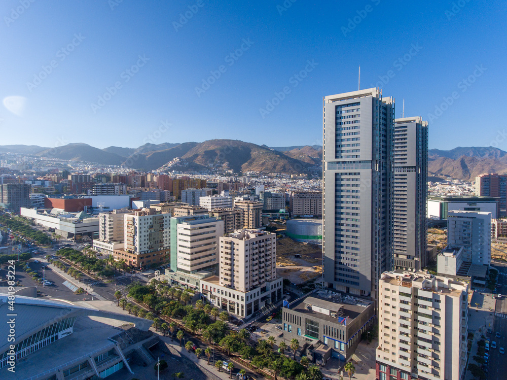 Aerial view of Santa Cruz de Tenerife on a sunny day. Skyscrapers and coastline from drone, Canary Islands