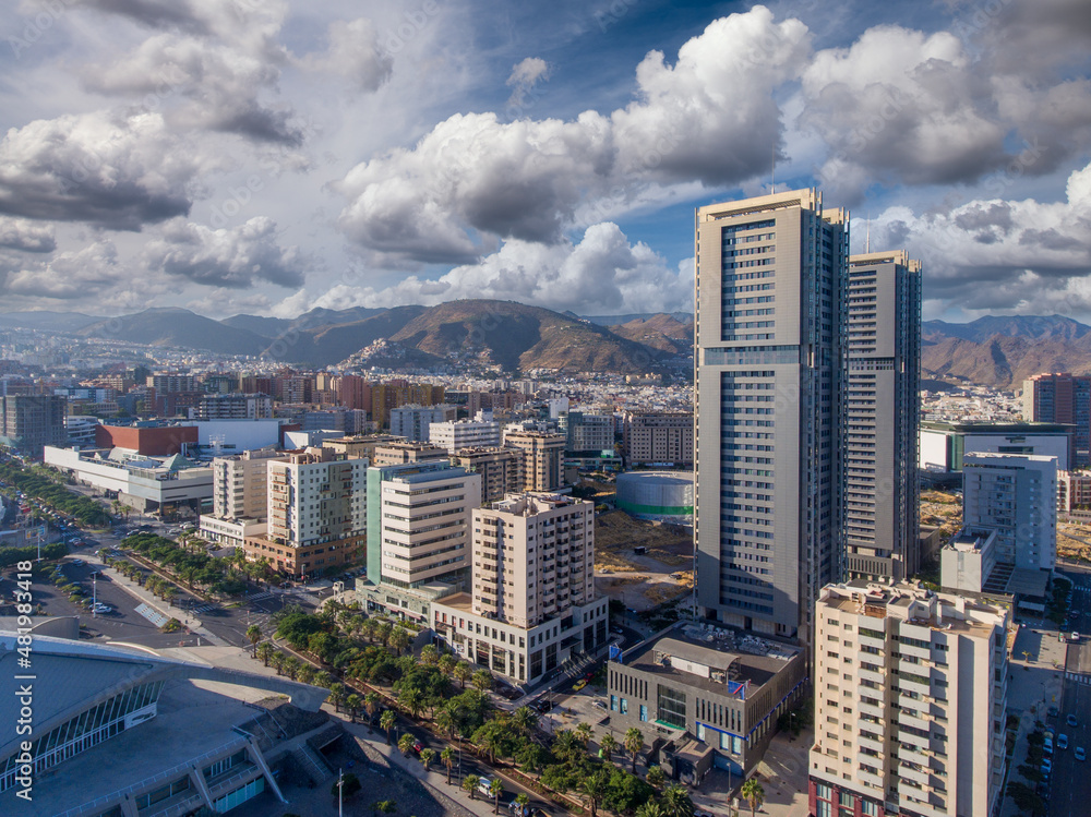 Aerial view of Santa Cruz de Tenerife on a sunny day. Skyscrapers and coastline from drone, Canary Islands..