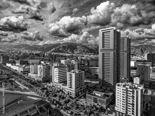 Aerial view of Santa Cruz de Tenerife on a sunny day. Skyscrapers and coastline from drone, Canary Islands..
