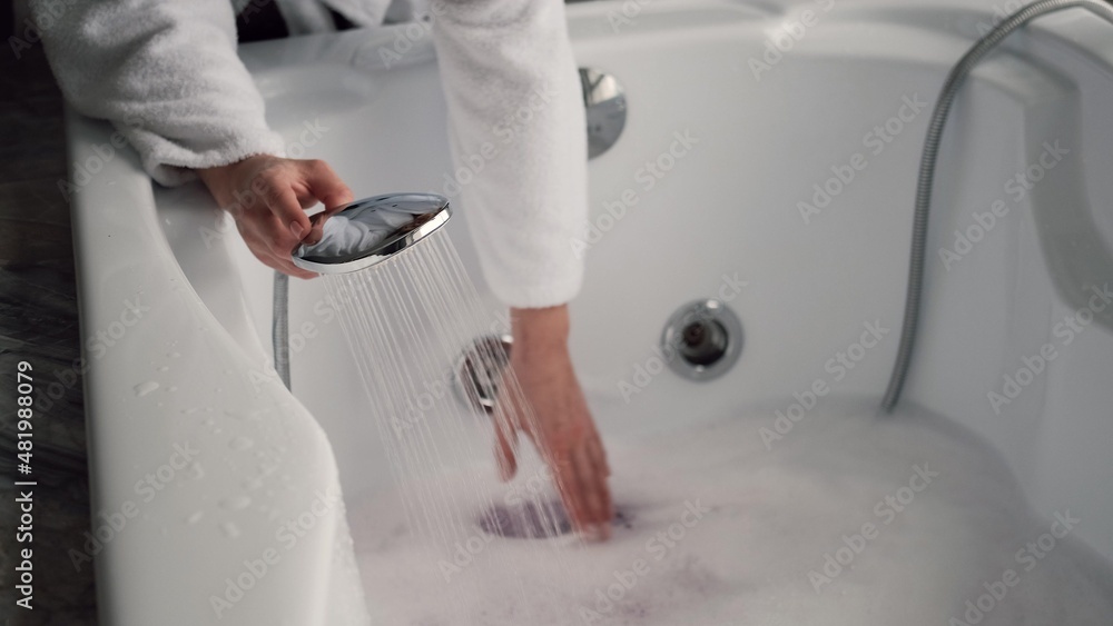 Pregnant woman filling bath with hot water Stock Photo Adobe Stock