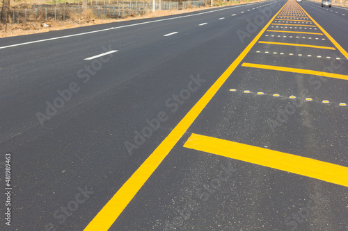 Asphalt road as abstract background  yellow line on the road texture