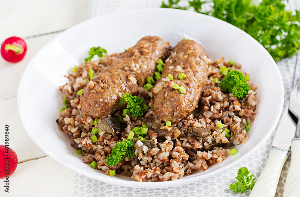Healthy dinner. Lunch bowl with buckwheat porridge, baked meat cutlets and roasted eggplants. Healthy dinner. Lunch bowl with buckwheat porridge, baked meat cutlets and roasted eggplants.
