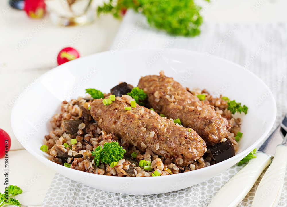 Healthy dinner. Lunch bowl with buckwheat porridge, baked meat cutlets and roasted eggplants. Healthy dinner. Lunch bowl with buckwheat porridge, baked meat cutlets and roasted eggplants.
