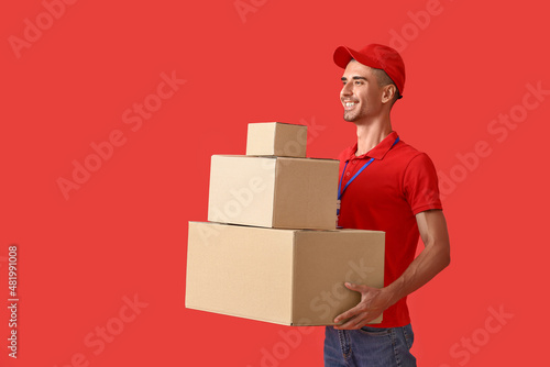 Male courier with parcels o...