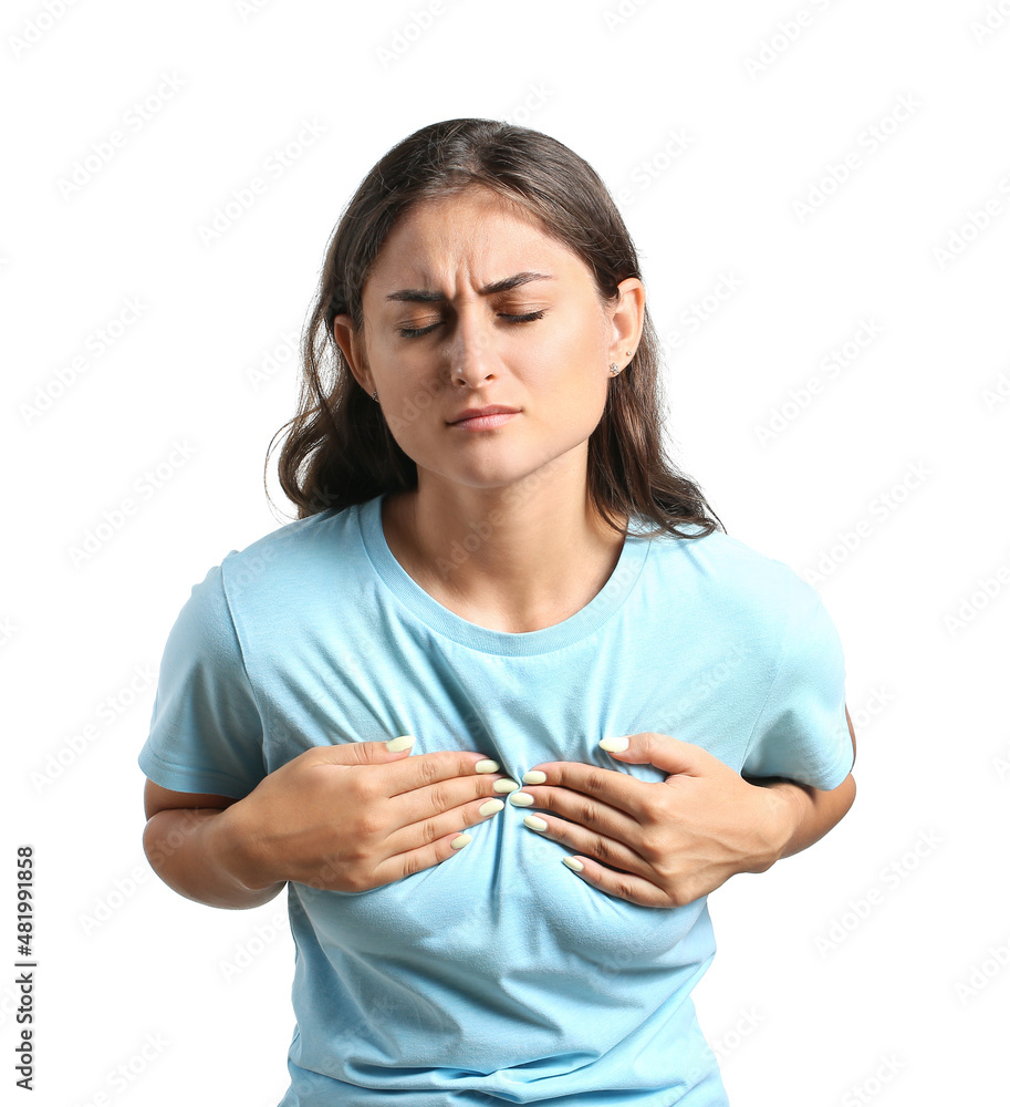 Young woman feeling discomfort in her breast on white background. Cancer awareness concept Young woman feeling discomfort in her breast on white background. Cancer awareness concept