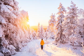 Young woman in winter forest in Finland