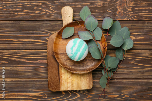 Murais de parede Composition with bath bomb and eucalyptus branches on wooden background
