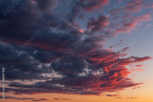 Colorful cloudscape in the light of the rising sun