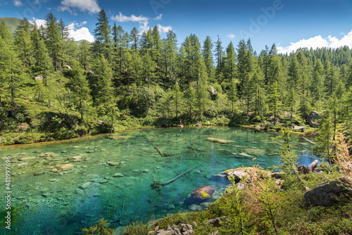 Lago delle Streghe alpine lake at Alpe Devero Italy with trees and clear water