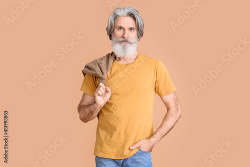 Senior man in yellow t-shir...