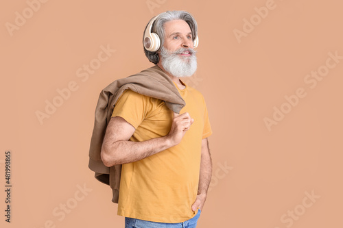 Senior man in wireless head...