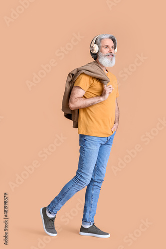 Senior man in wireless head...
