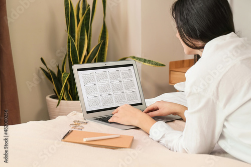 Woman using digital calenda...