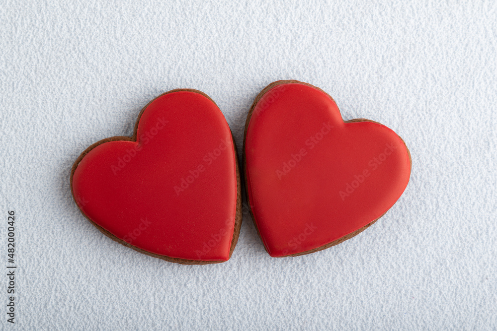 Homemade red Valentines Day cookies shape of hearts on white background Homemade red Valentines Day cookies shape of hearts on white background