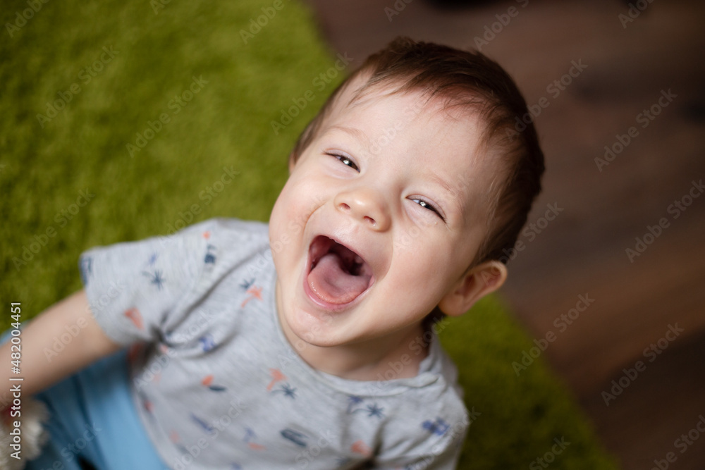 Handsome baby laughs and looking at the camera, Cute happy baby toddler laughing fearless Handsome baby laughs and looking at the camera, Cute happy baby toddler laughing fearless