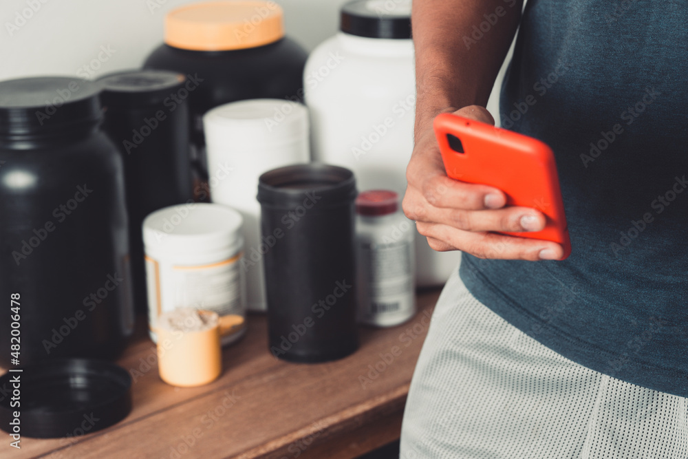 Hands holding a smartphone using nutritional app Hands holding a smartphone using nutritional app