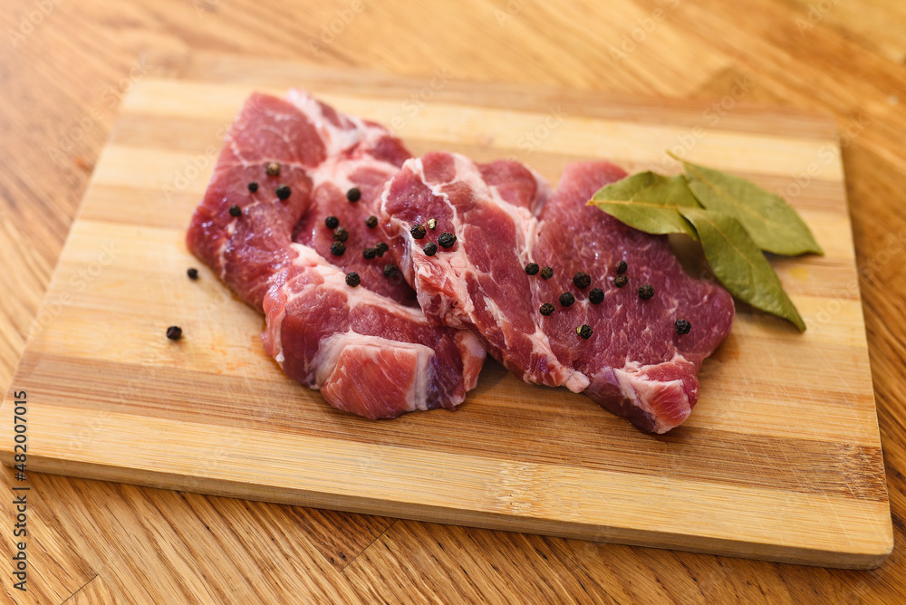 raw meat on a cutting board raw meat on a cutting board