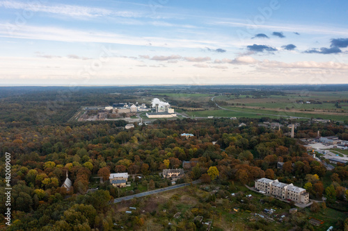 An aerial drone view of the industrial city in the Baltic. Plant for the production of concrete. Wind park. © 360PANO.EU