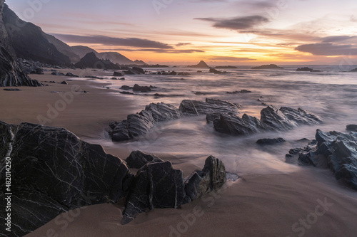 Ocean sunset in the Carreagem Beach. Aljezur. Algarve