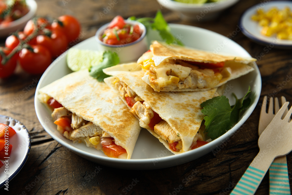 Homemade quesadilla with chicken and tomatoes Homemade quesadilla with chicken and tomatoes