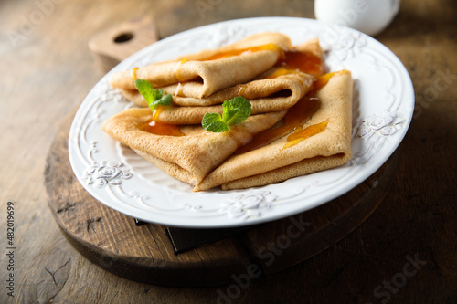Homemade crepes with apricot jam