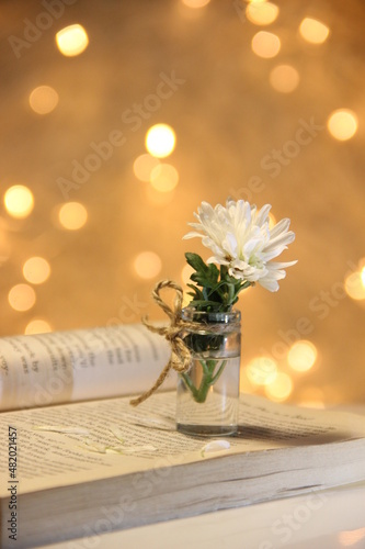bouquet of flowers on the book