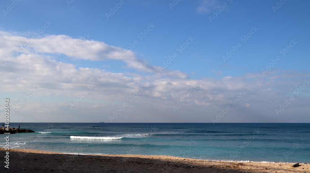 Empty beach photo. Beautiful coastline with calm seawater, sand, no people. 