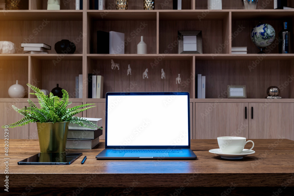 Laptop with white screen on the table. Work from home. Laptop with white screen on the table. Work from home.