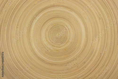 Wooden background, round rings on a wooden background, sawn wood