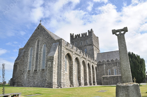 The Cathedral Church of St. Brigid in Kildare. Church of Ireland. Irish Gothic style. Ireland. Rear view with irish cross. Concept: religion, irish, traditional