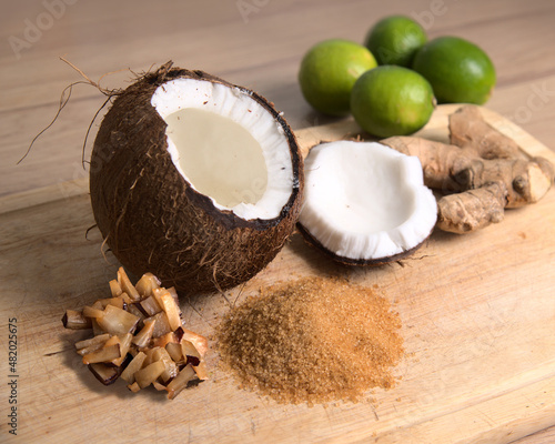 Jamaican coconut drop with the ingredients, Coconut, Brown sugar Root ginger, and limes. 